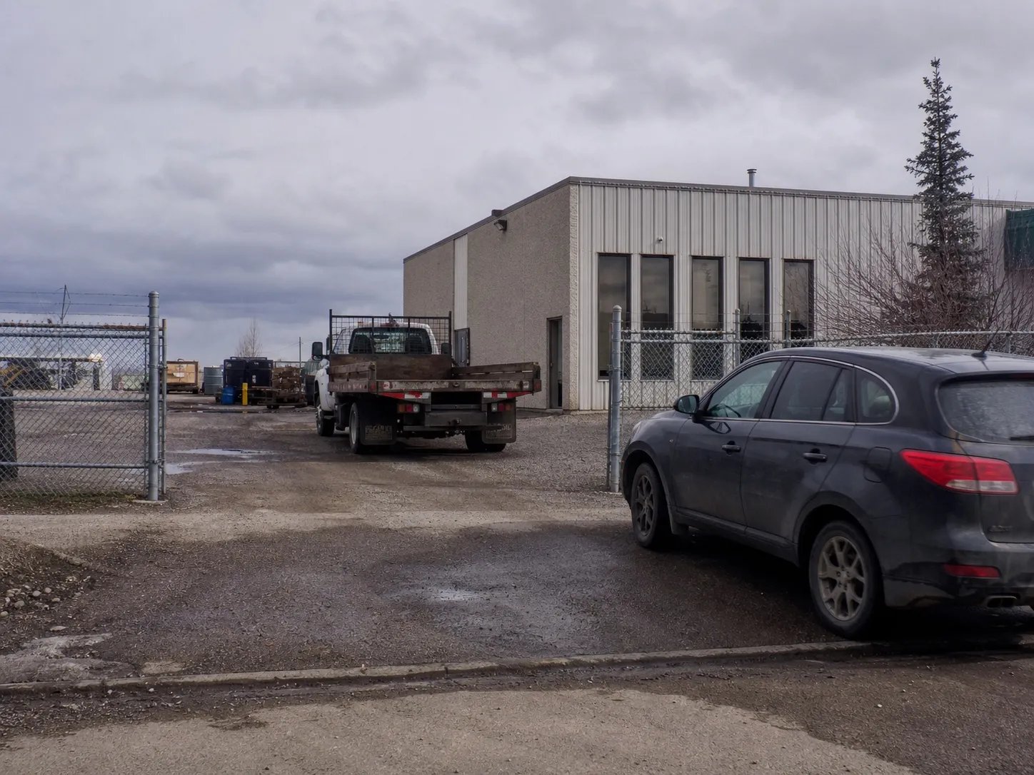 A modest industrial office and yard, arrived at by appointment.
